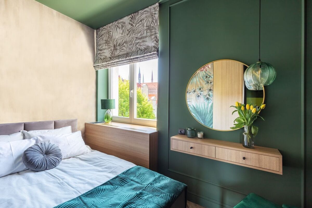 Elegant small bedroom with comfortable bed. Interior design and home staging