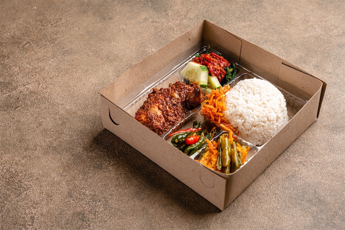 In Indonesian it is called Rice Box or Nasi kotak with ayam rendang. Usually distributed during celebrations or catering packaging.